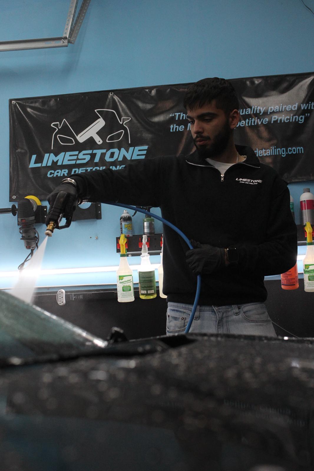 Car detailing professional at work